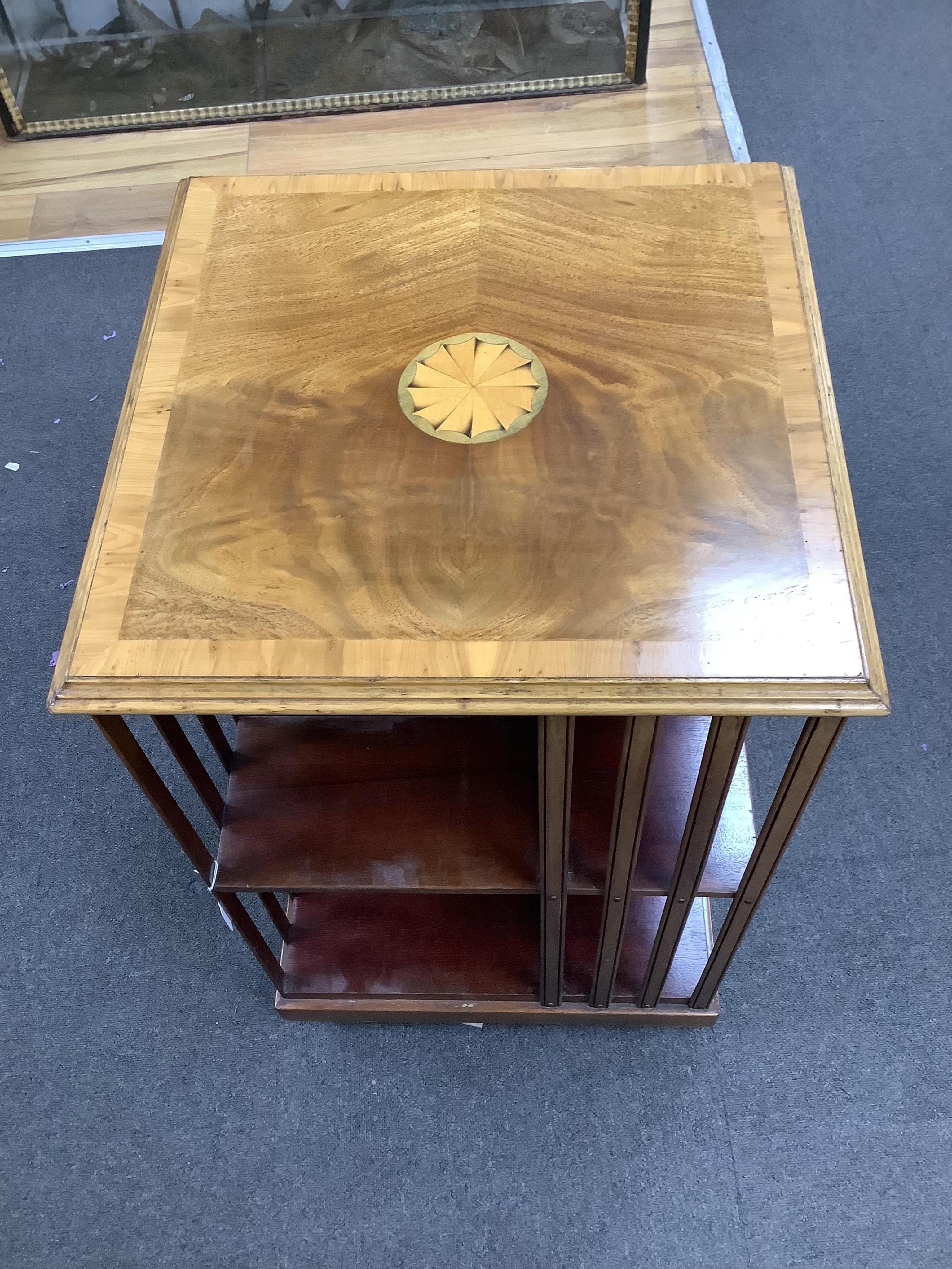 An Edwardian style paterae inlaid mahogany revolving bookcase, width 48cm, depth 48cm, height 81cm. Condition - good